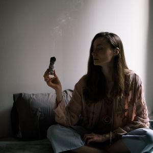 Incense smoke in a tranquil yoga practice space.